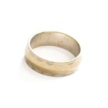 A Textured Band Ring, stamped '750', finger size L1/2Gross weight 5.3 grams.