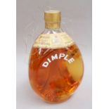 A Bottle Of Dimple Old Blended Scotch Whisky, 1960s bottling, 70º proof, 26 2/3 fl. ozs. (one