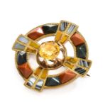 A Citrine and Agate Brooch, measures 3.3cm diameterThe brooch is in fair condition with wear to