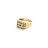 A 9 Carat Gold Triple Row Diamond Ring, finger size R1/2Gross weight 6.6 grams.