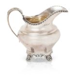 A Victorian Provincial Silver Cream-Jug, by John Walton, Newcastle, 1846, tapering and on four