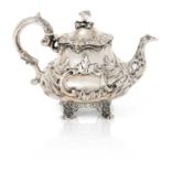 A Victorian Silver Teapot, by William Ker Reid, London, 1842, tapering and on four shell and foliage