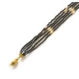 A Hematite and Cultured Pearl Five Strand Necklace, clasp stamped '750', length 40cmGross weight