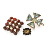 Three Brooches, comprising of a garnet and hairwork example, a garnet example and a blue stone