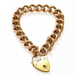 A Curb Link Bracelet, each link stamped ‘9C’, with a heart shaped padlock stamped ‘9CT’, length 19.