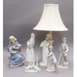 A Collection of Lladro and Nao Figures, together with a similar Spanish figural table lamp