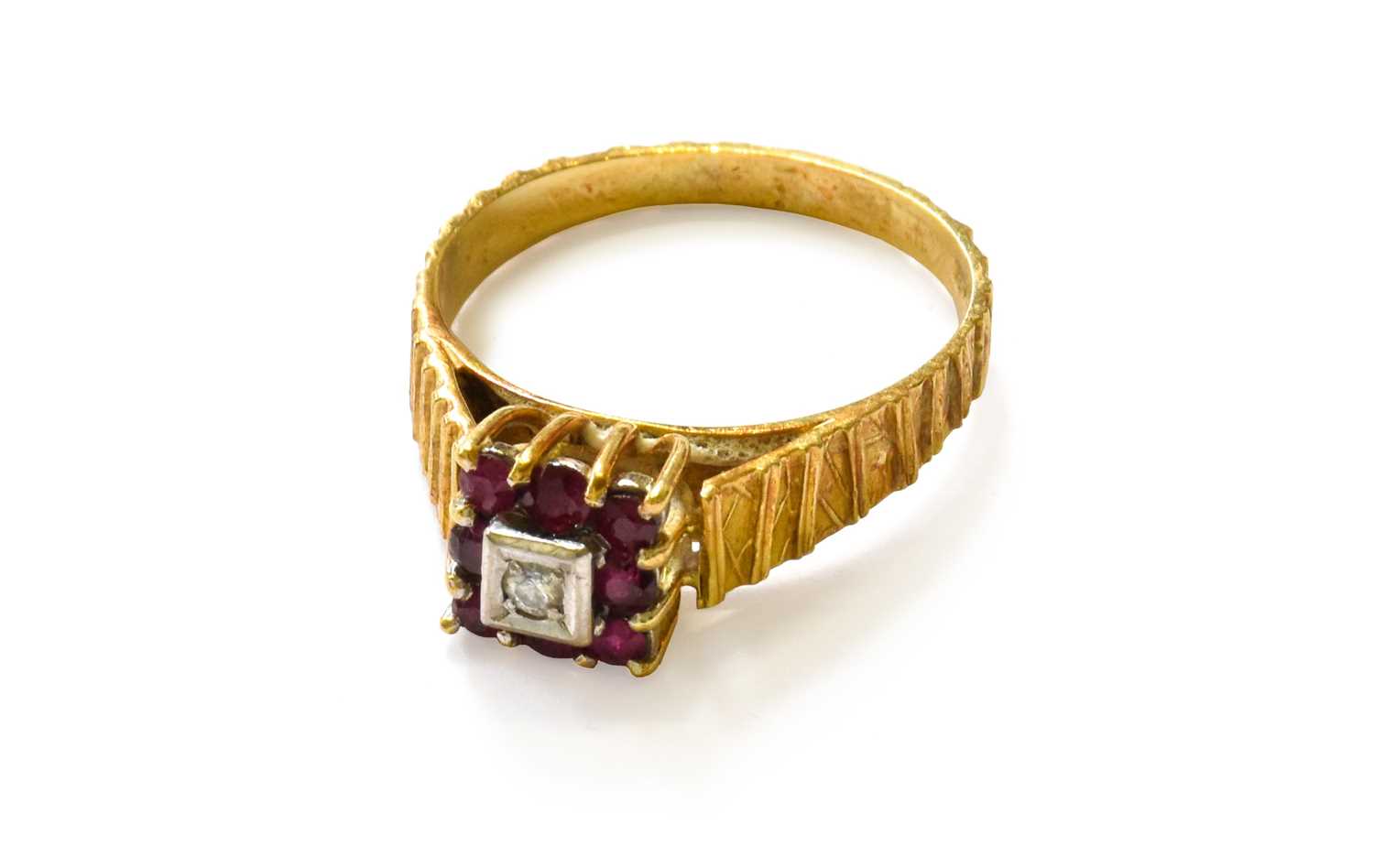 An 18 Carat Gold Ruby and Diamond Cluster Ring, finger size TThe ring is in good condition. It is