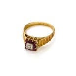 An 18 Carat Gold Ruby and Diamond Cluster Ring, finger size TThe ring is in good condition. It is