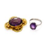 A 9 Carat White Gold Amethyst Ring, finger size M1/2; and An Amethyst Brooch, unmarked, measures 3.