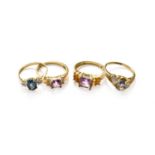 Four 9 Carat Gold Gem-Set Rings, including a blue topaz, iolite and amethyst examples, of varying