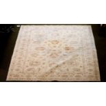 An Afghan Ziegler Carpet, the ivory field with an all over design of palmettes and vines enclosed by