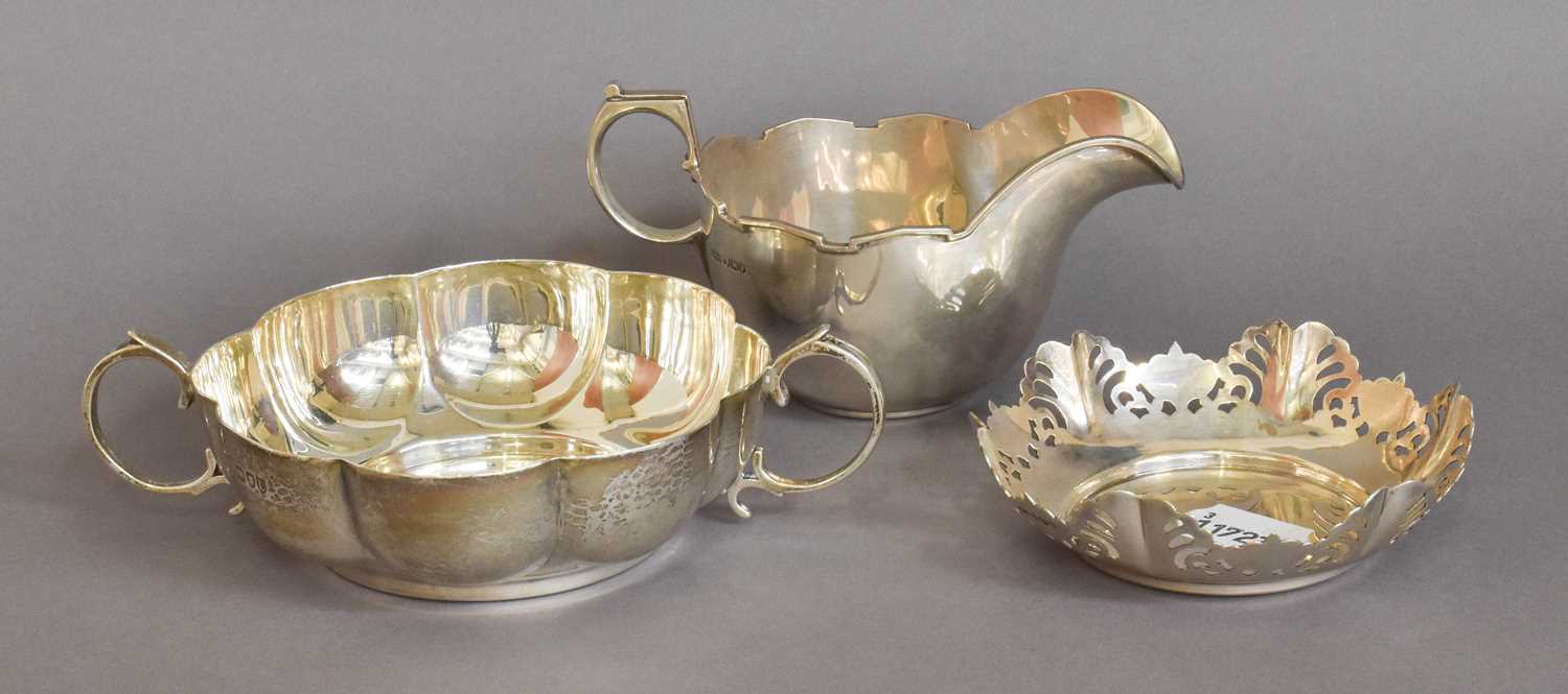 Three Silver Items, comprising: a Victorian dish with lobed sides and two scroll handles, 18cm