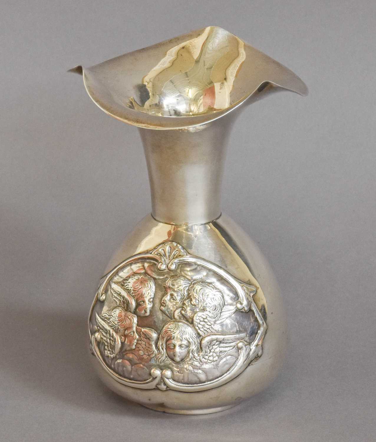 A Victorian Silver Vase, by William Comyns, London, 1898, baluster and with flaring shaped rim,