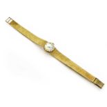 A Lady's 9 Carat Gold Tissot WristwatchThe bracelet is 9 carat gold. Total watch weight is 28.9