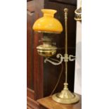 A Victorian Brass Adjustable Oil Lamp, converted to electricity together with five coloured