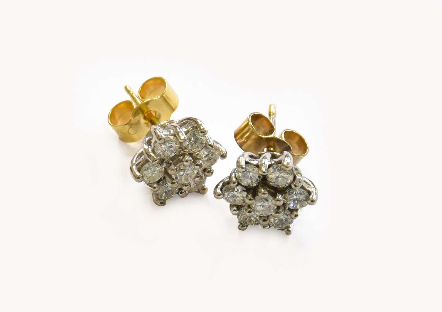 A Pair of 18 Carat Gold Diamond Cluster Earrings, with post fittingsGross weight 2.9 grams.