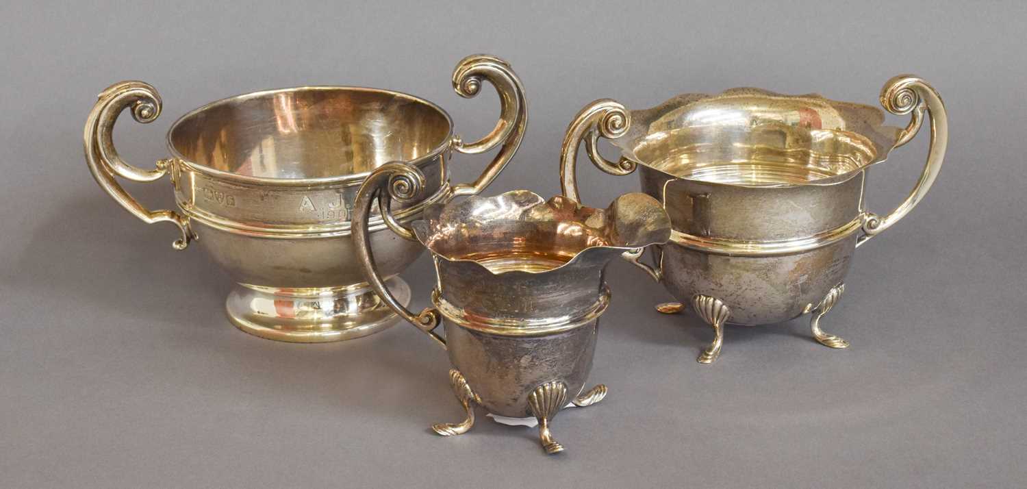 An Edward VII Silver Cream-Jug and Sugar-Bowl, Birmingham, 1906, each engraved with initials, the