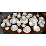 A Mintons Gold Rose Dinner and Tea Service, including tureens, serving dishes, sauceboats on stands,