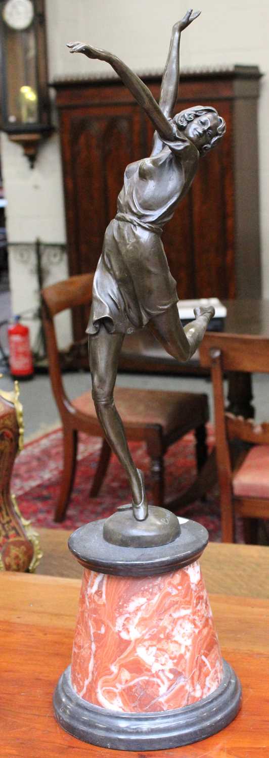 After Bruno Zach: an Art Deco style bronze and marble figure, 65cm high