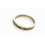 A Diamond Half Hoop Ring, unmarked, finger size MEvidence of re-sizing. Gross weight 2.0 grams.