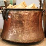 A Large 19th Century Copper Log Bin, with twin iron handles, 55cm diameterA planished finish but