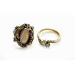 A Diamond Two Stone Twist Ring, stamped '18CT&PT', finger size N1/2; and An Abalone Shell Ring,