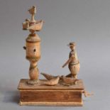 Folk Art: A Hand-Cranked Wooden Automaton Bird Feeding Toy21cm high by 14cm wide.