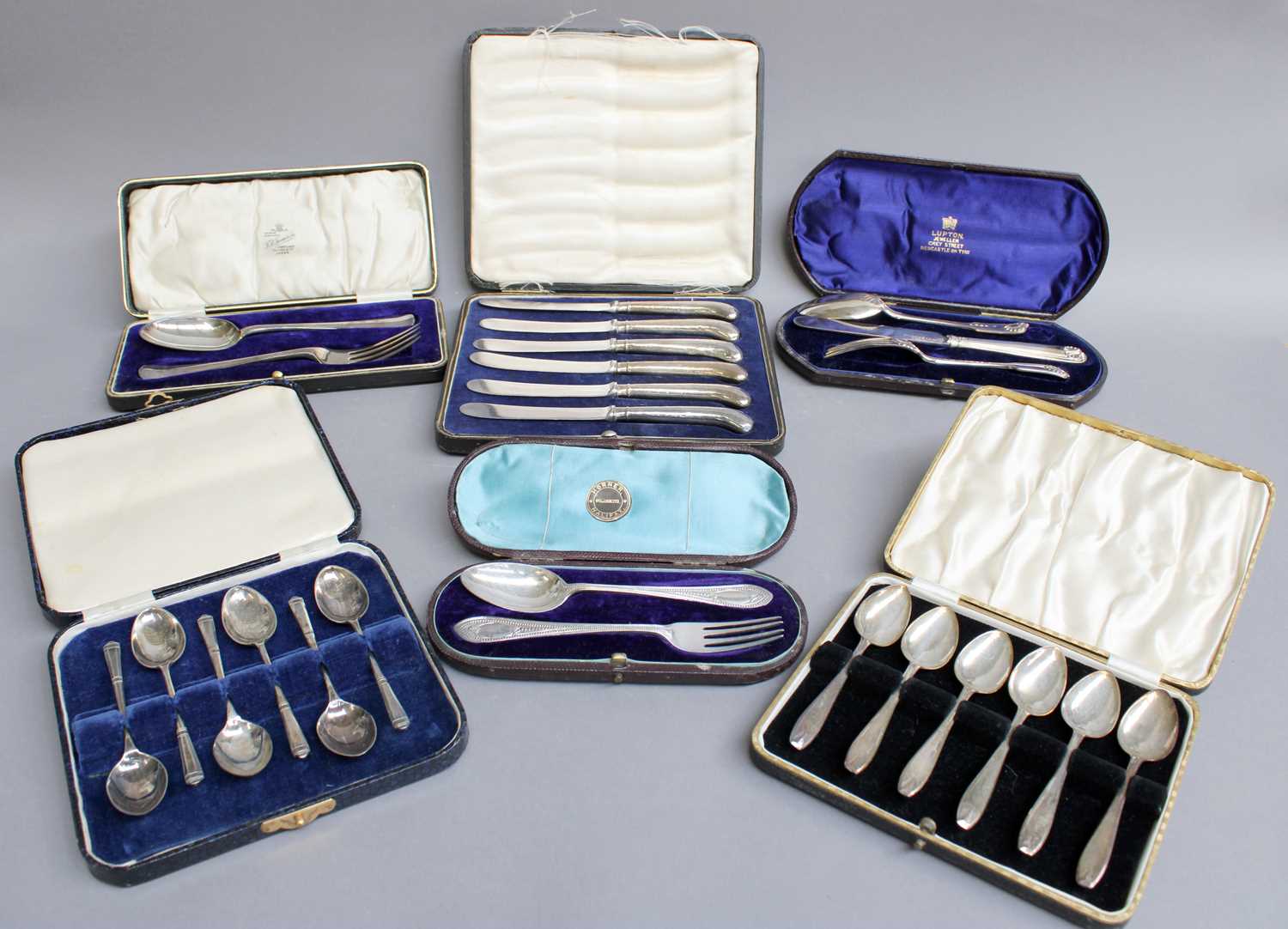 A Collection of Assorted Cased Sets of Silver Flatware, comprising two cased sets of six