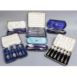 A Collection of Assorted Cased Sets of Silver Flatware, comprising two cased sets of six