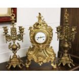 A Modern Gilt Metal Striking Mantel Clock Garniture, 20th century, clock dial inscribed Imperial,