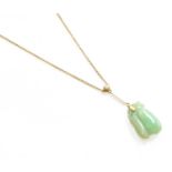 A Jade and Split Pearl Necklace, stamped '9CT', drop length 4.3cm, necklace length 39.5cmThe
