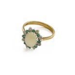 A 9 Carat Gold Opal, Diamond and Emerald Cluster Ring, finger size RGross weight 3.0 grams.