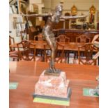 An Art Deco Style Bronze Figure, after Chiparus, raised on stepped variegated marble base, 48cm