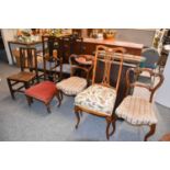 A Pair of Victorian Balloon Back Chairs, An Edwardian Nursing Chair, A 19th Century Oak Plank Seated