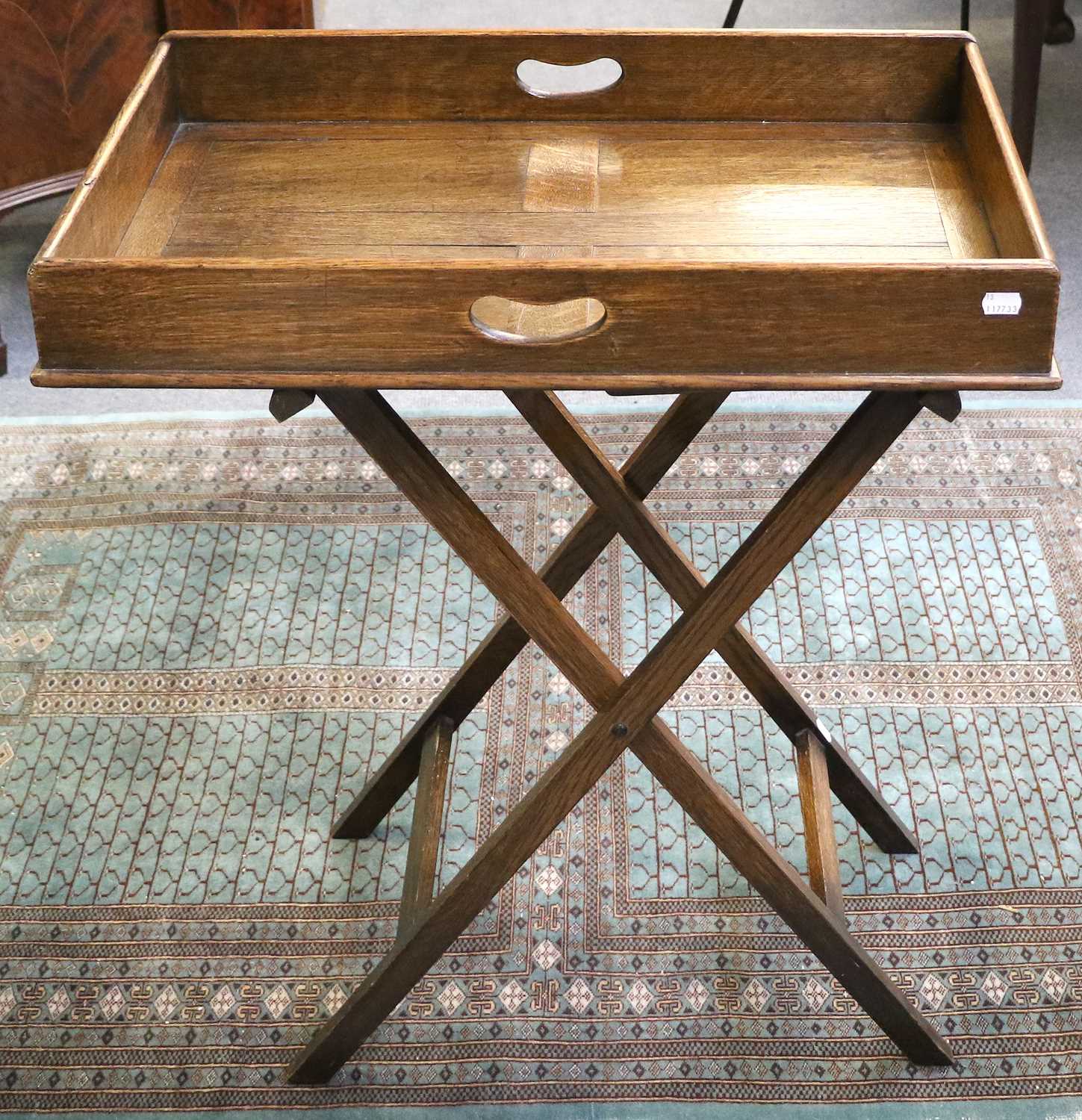 An Oak Butler's Tray on Folding Stand, 70cm by 46cm by 84cm; together with A Victorian Carved Walnut