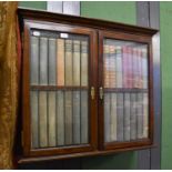 A Small Cabinet, the glazed doors with dummy book spines, 85cm by 23cm by 74cm