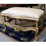 A Louis XV Style Gilt Framed Stool, the shaped paded seat above a framework carved with shells and