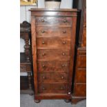 A Mahogany Seven Drawer Wellington Chest, late 19th century, with folding easel top and raised on