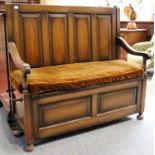 A 1920's Panelled Oak Box Settle, fitted with integral umbrella/stick-stand, 110cm by 48cm by 103cm