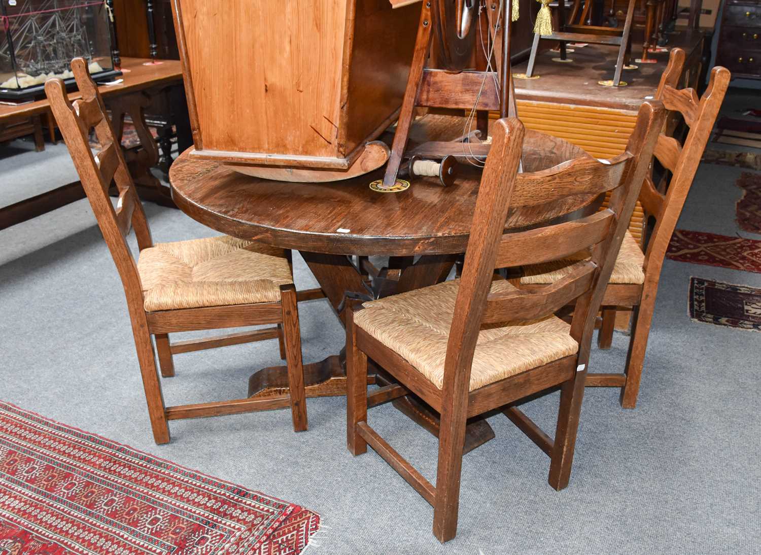 A Rustic Oak Centre Pedestal Kitchen Table, 20th century, 120cm (diameter) by 75cm, together with