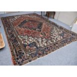 Heriz Carpet, North West Iran, circa 1940, the pale terracotta field of angular vines centered by an