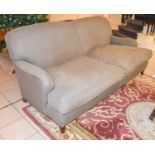 A Grey Upholstered Two Seater Sofa, on a mahogany frame with brass castors, 190cmA few marks and