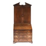 A George III Mahogany Bureau Bookcase, late 18th century, the upper section with architectural