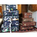 A Collection of Vintage Suitcases, comprising four leather examples, three monogrammed M.M, four