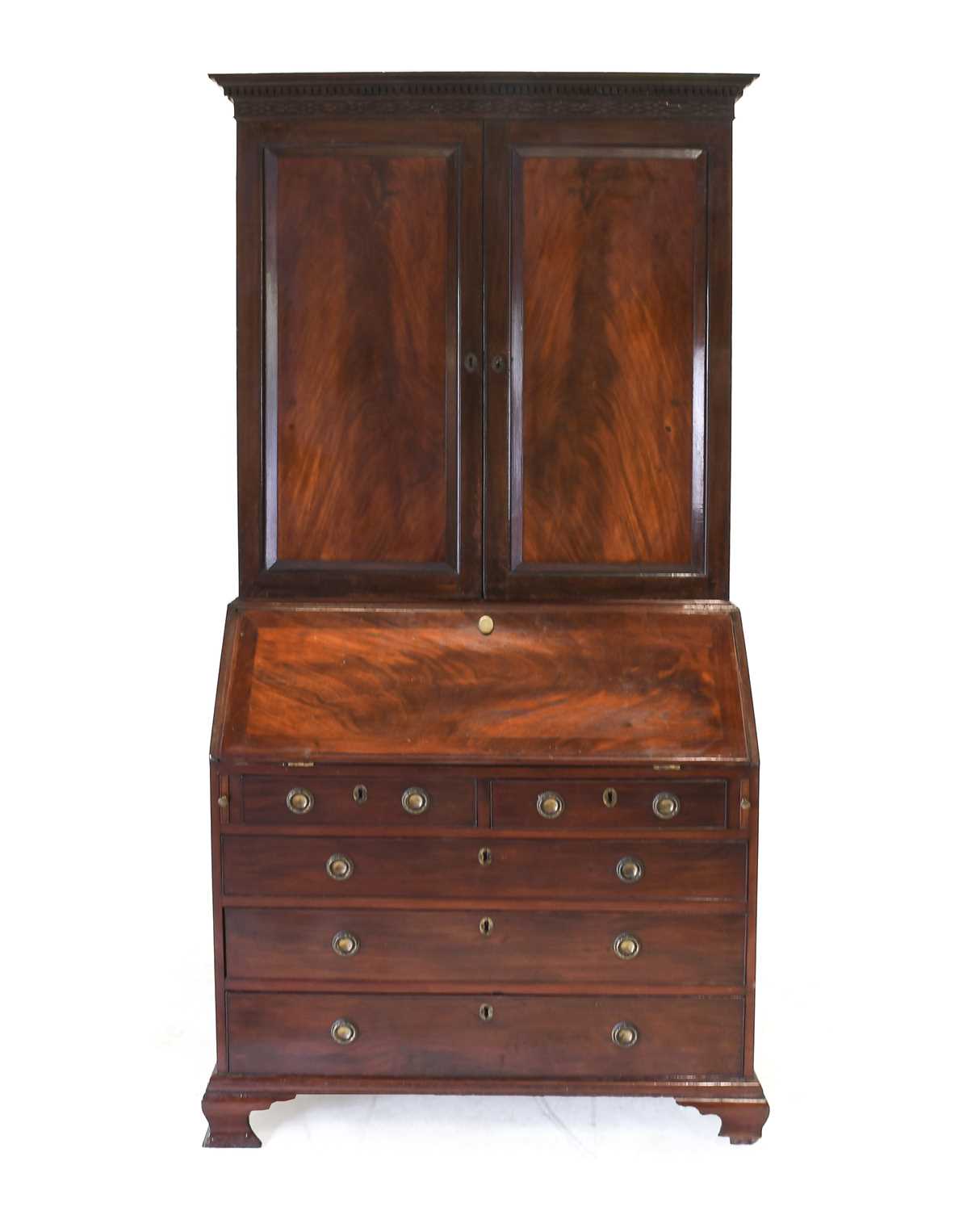 A George III Mahogany Bureau Bookcase, circa 1770, the moulded, dentil and blind fret-carved