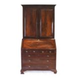 A George III Mahogany Bureau Bookcase, circa 1770, the moulded, dentil and blind fret-carved