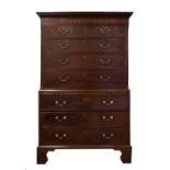 A George III Mahogany Chest on Chest, late 18th century, the dentil cornice above a plain frieze and