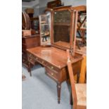 A Mahogany Dressing Table, 1st quarter of the 20th century, with triptych mirror, moulded drawer