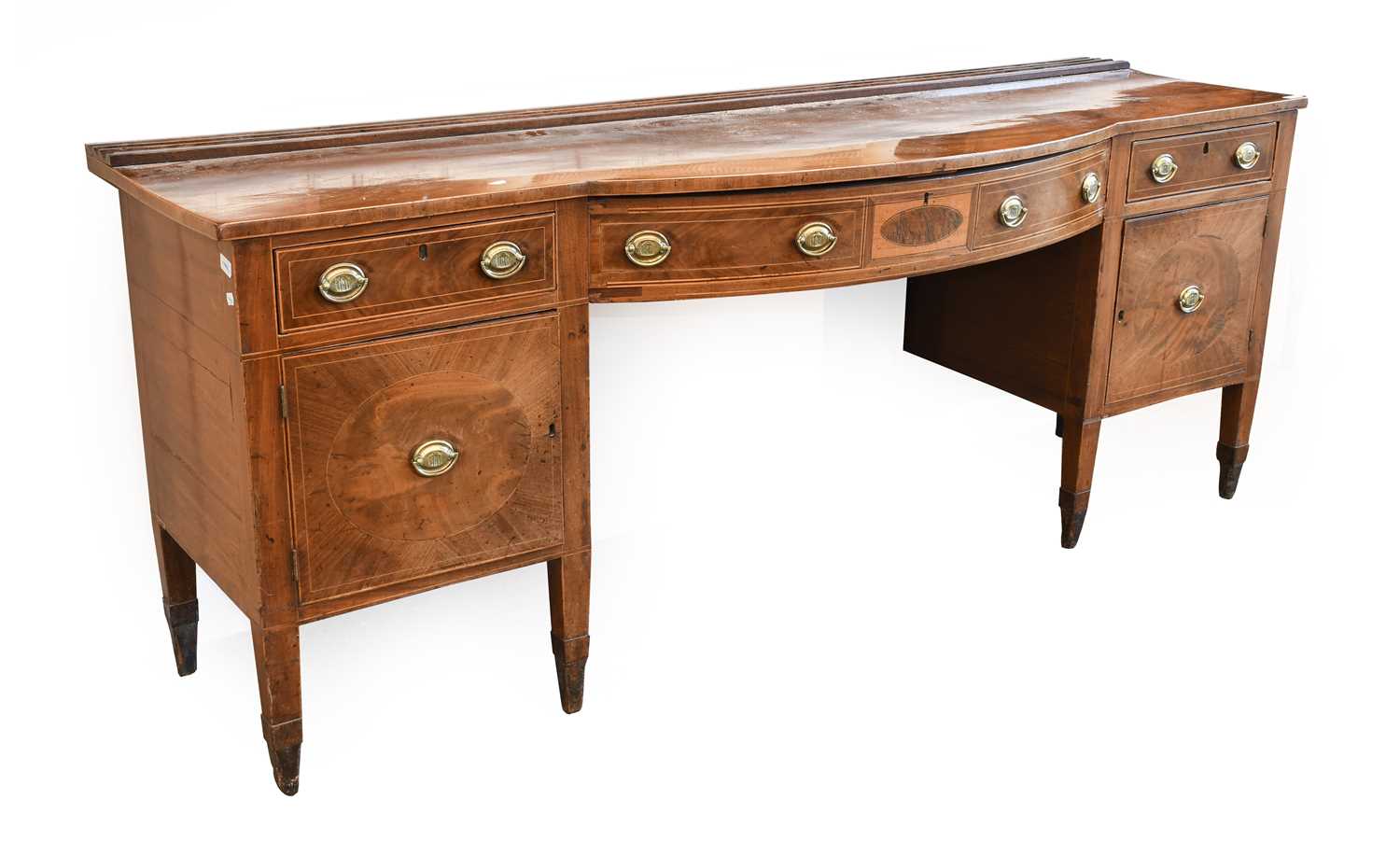 A George III Mahogany Bowfront Sideboard, late 18th century, the moulded plate rack above a bowfront