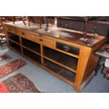 A Victorian Scumble Glazed Pine Four Drawer Work Bench, with a mahogany top and six open
